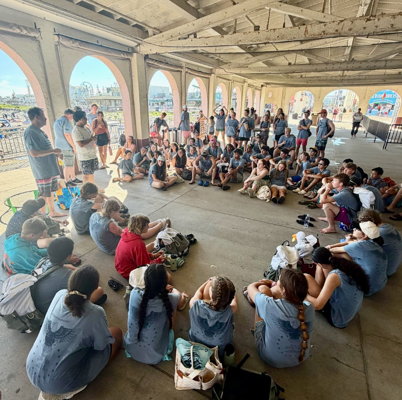 Joshua Generation gathered together in an oceanfront pavilion