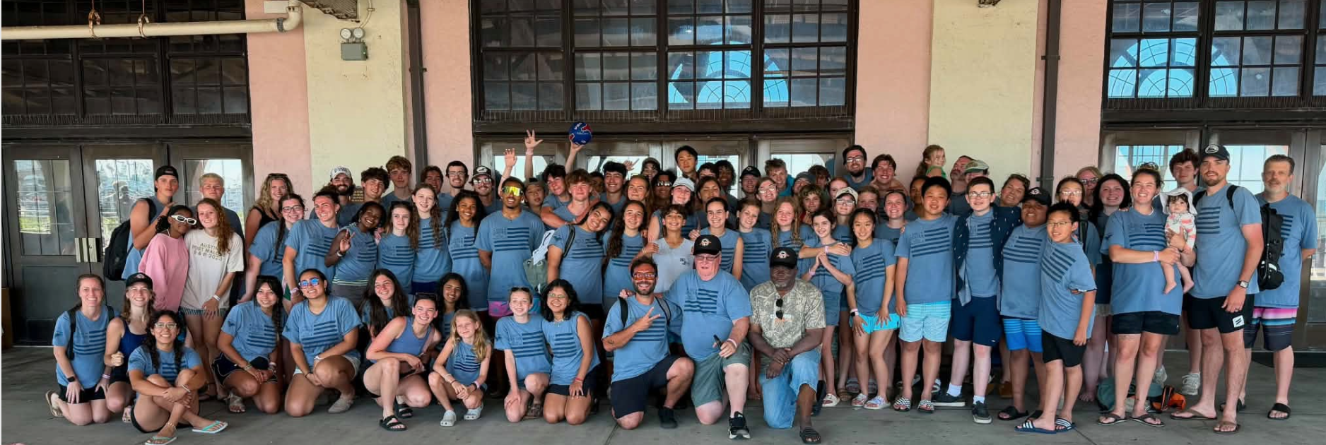 Joshua Generation group together in blue shirts
