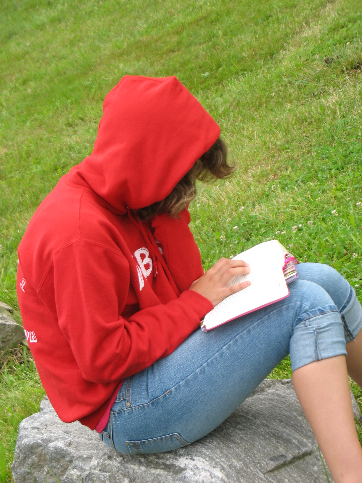 A participant reading the Bible during personal quiet time outdoors