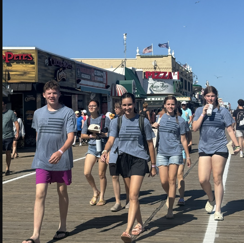 Joshua Generation friends walking together on the boardwalk